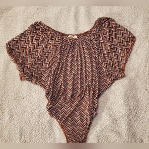 Size large willow root off the shoulder body suit. Worn a couple times.